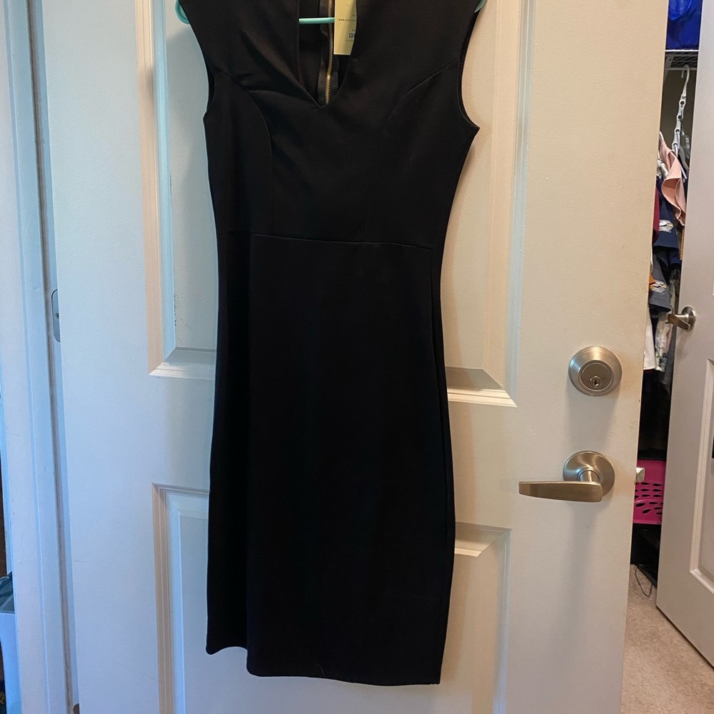 Black form-fitting professional dress